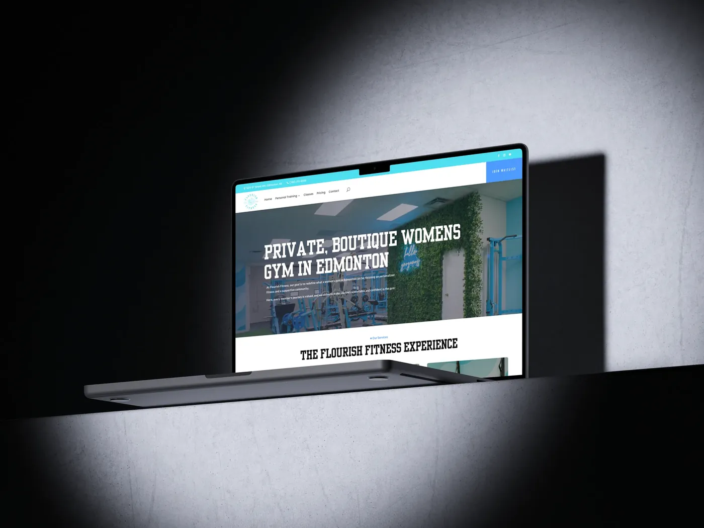 Flourish Fitness website on a laptop
