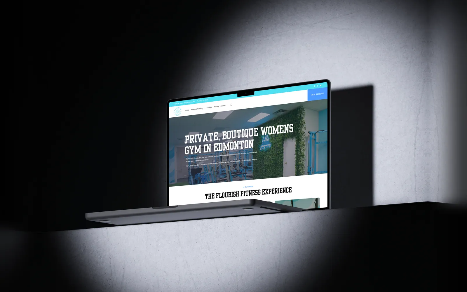 Flourish Fitness website on a laptop